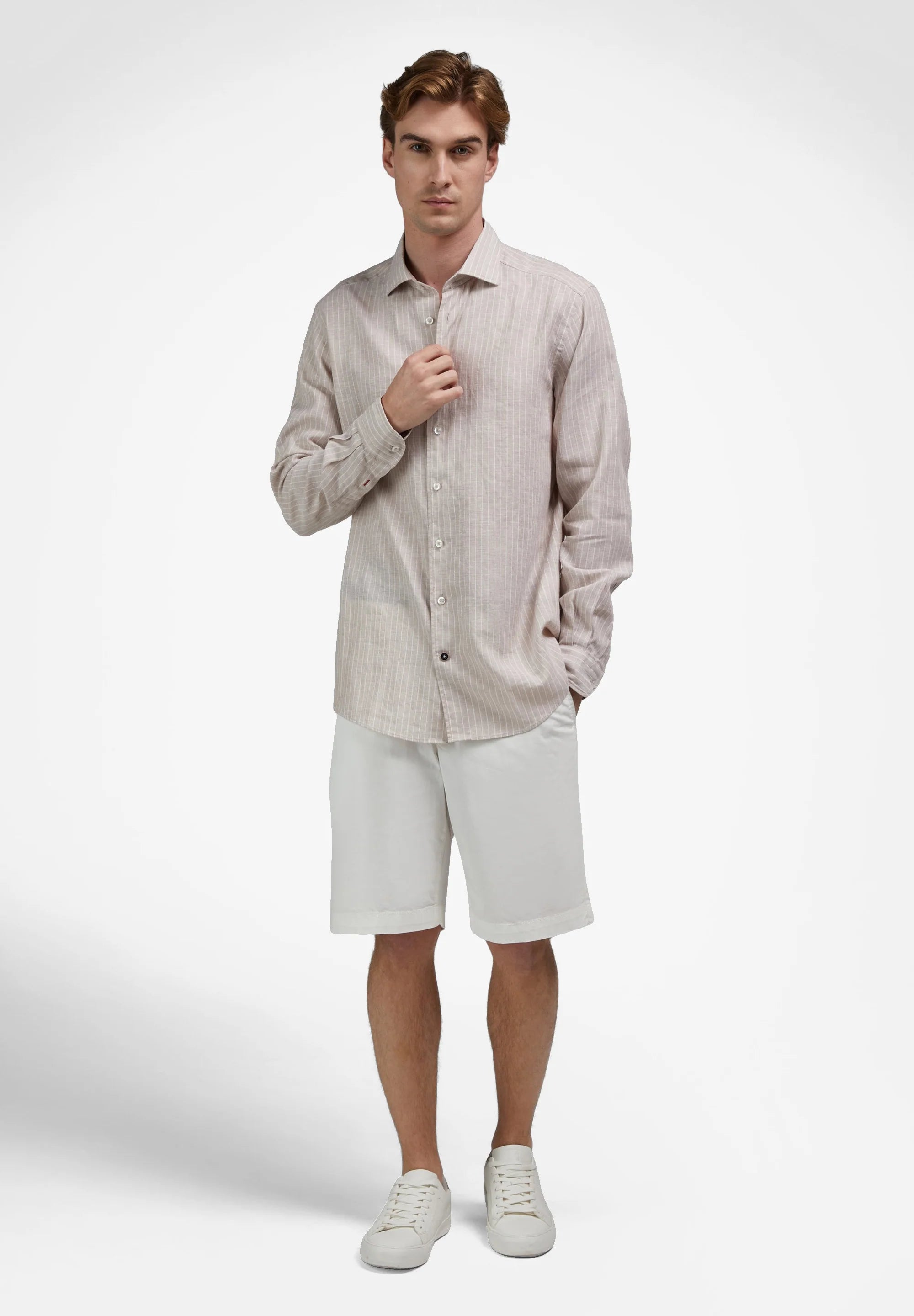 Sand-colored long-sleeve button-up shirt with subtle vertical stripes, a standard collar, and buttoned cuffs.