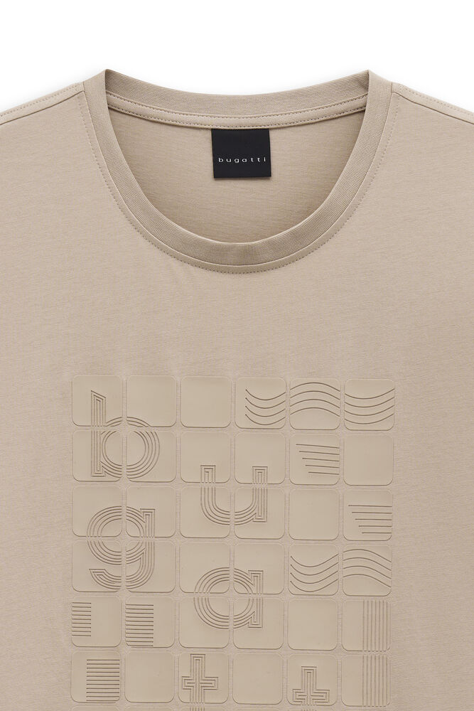 Beige T-shirt with a ribbed crew neck. Features an embossed square grid design on the front with abstract geometric patterns