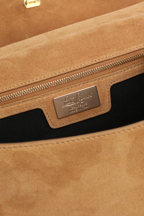 Caramel suede bag interior with a gold-toned zipper, black lining, and a gold-toned metal plaque reading 'Loro Piana'.