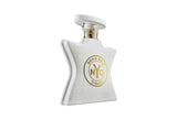 White perfume bottle with gold logo on a white background