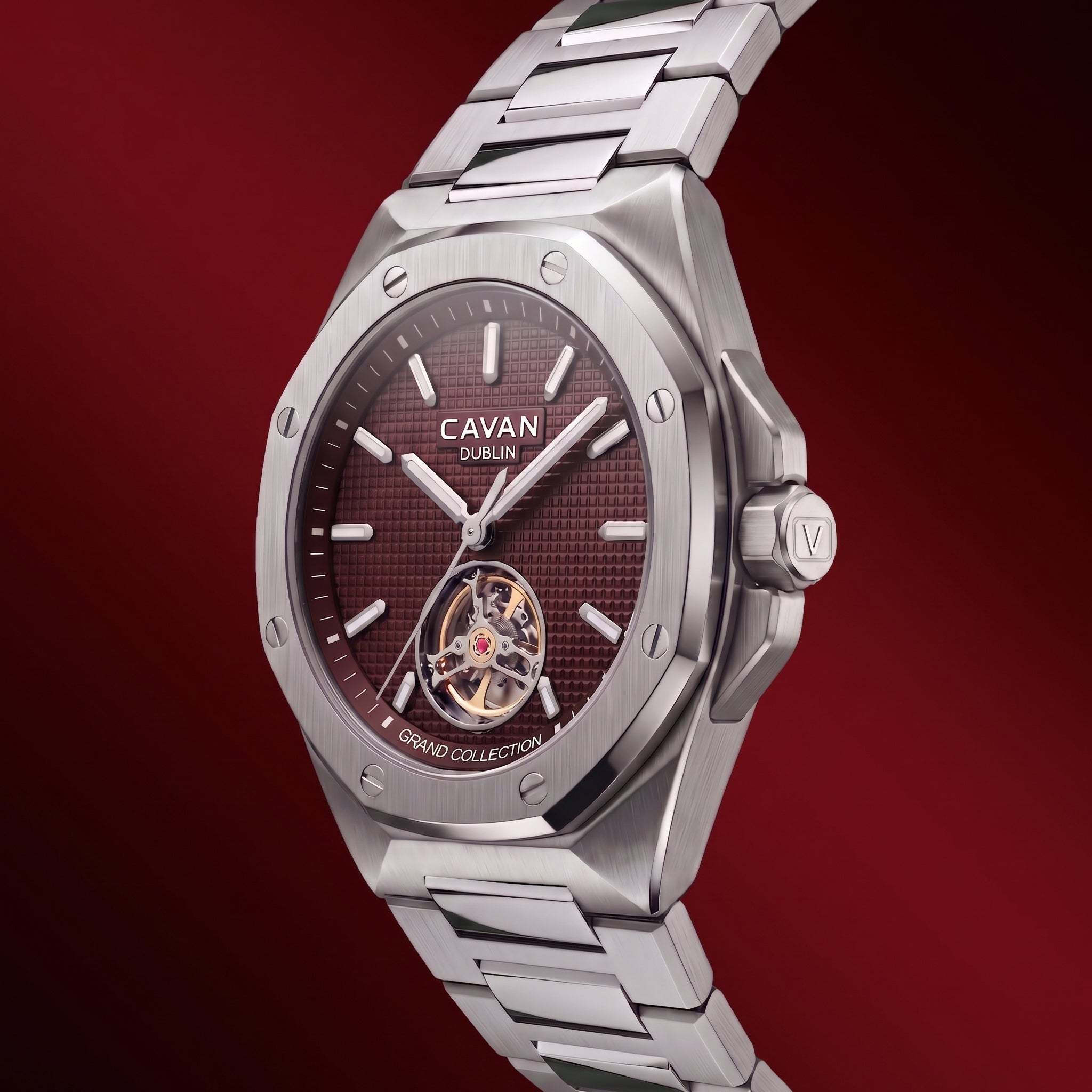 Silver-toned watch with an octagonal case, brushed finish, and a dark red textured dial. Open-heart movement with gold-toned