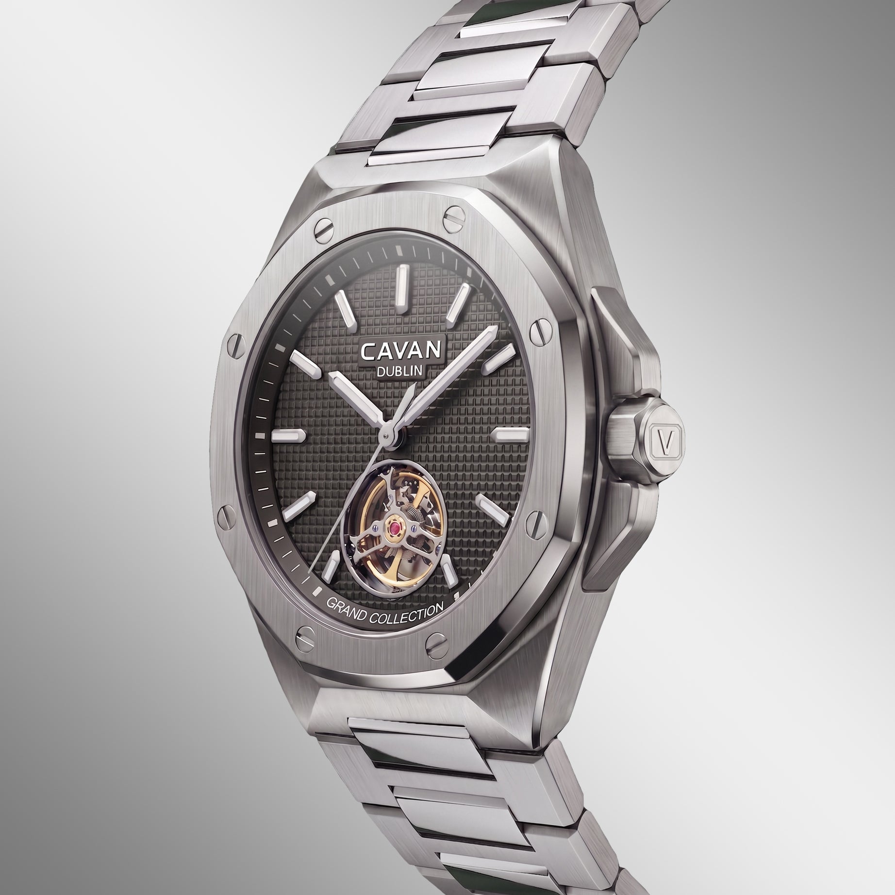 Silver-toned watch with octagonal case, dark gray textured dial, silver-toned markers, exposed gold-toned tourbillon, and met
