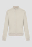Light khaki zip-up jacket with a stand collar, silver-toned zipper pull, two side pockets, long sleeves with ribbed cuffs, an