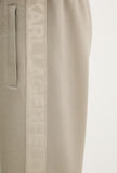 Khaki sweatpants with a vertical logo tape accent featuring tone-on-tone 'KARL LAGERFELD' text and a slit pocket.