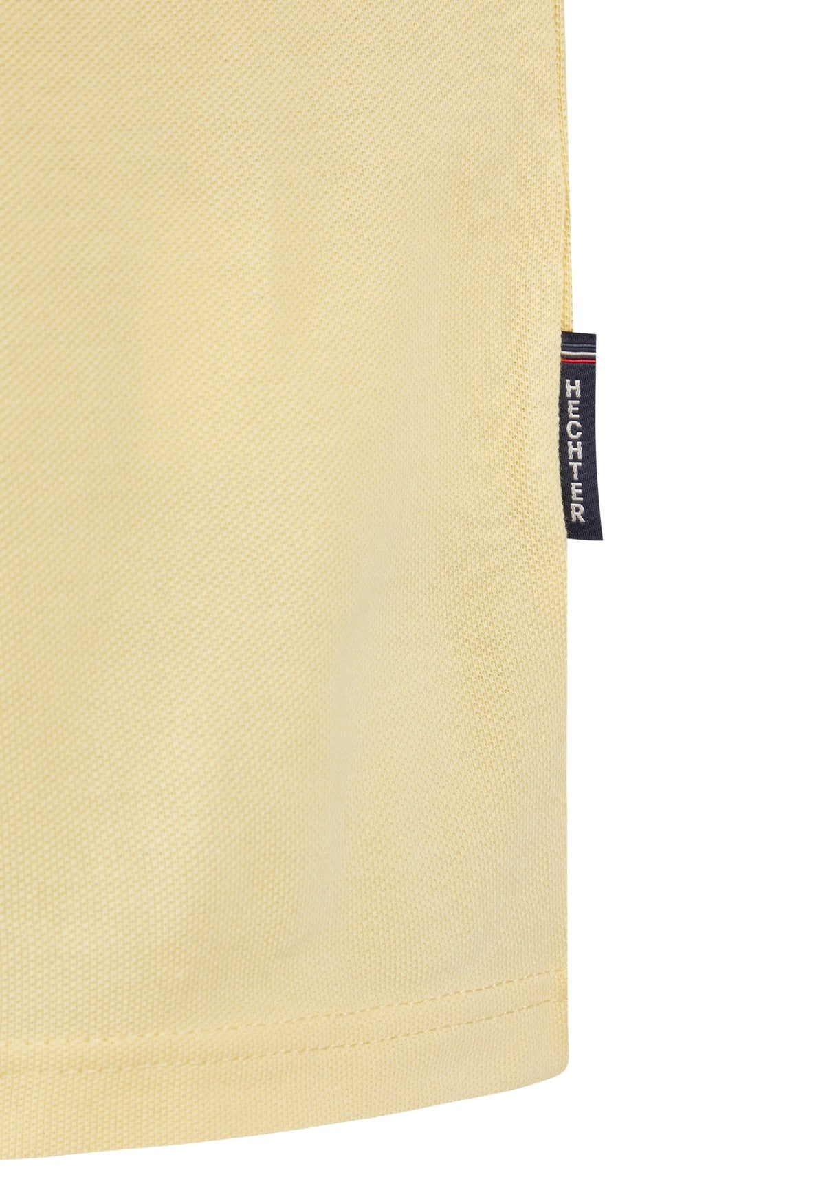 Vanilla yellow pique knit polo shirt with a dark blue 'HECHTER' brand tag featuring red, white, and blue stripes on the right