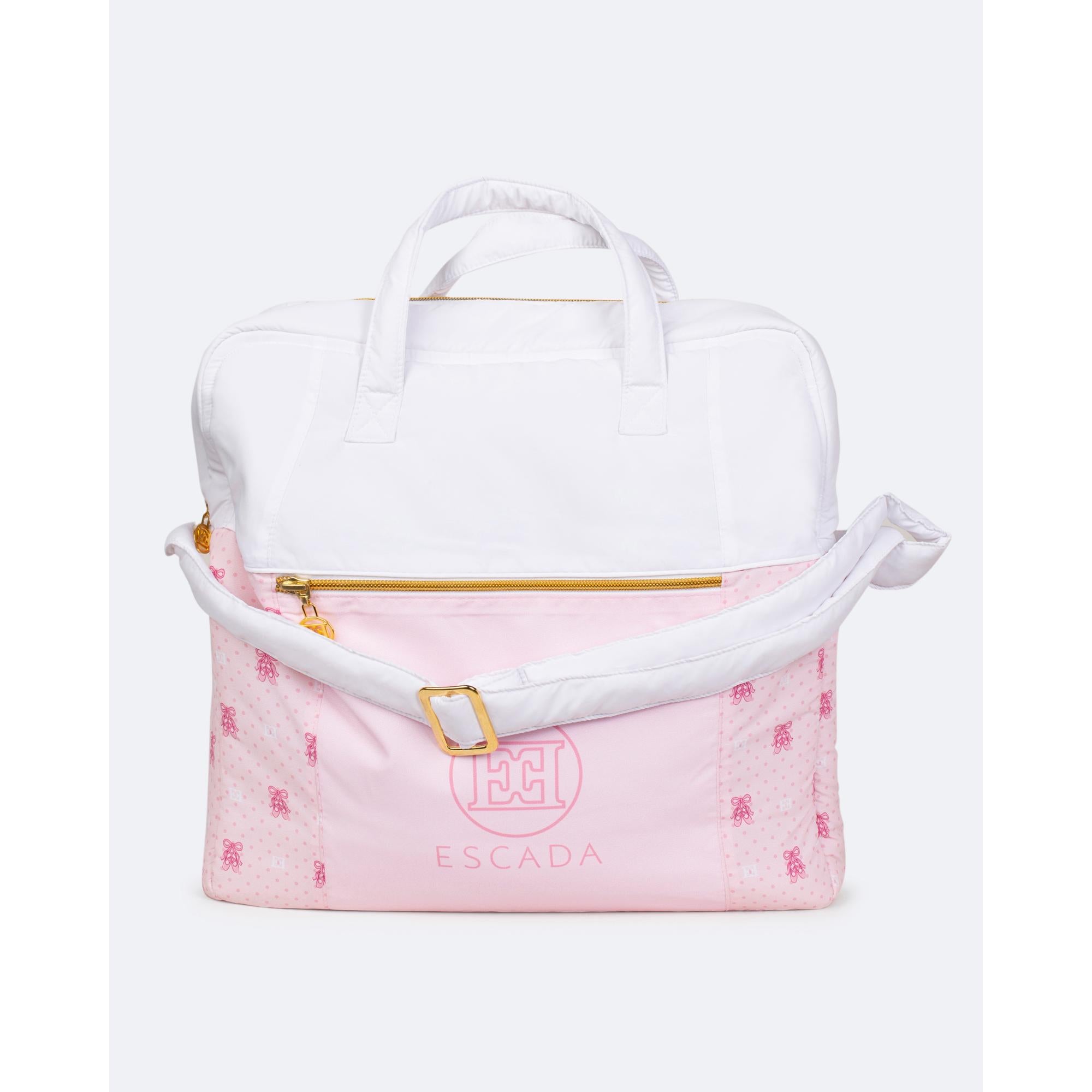 White and pink changing bag. Pink bottom has teddy bear and polka dot print, Escada logo. Gold-toned zipper, white handles, a