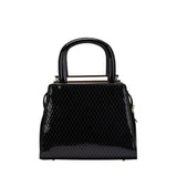 Rear view of the handbag highlighting the high-shine black patent finish with a diamond-quilted embossed texture.