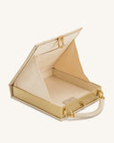 Open khaki fabric and gold-toned book-style top handle bag with a cream handle. Light beige interior has a pocket and clasp.