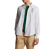 Optic white long-sleeved button-down shirt with a classic collar, buttoned cuffs, and dark embroidered chest graphic.