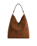 Brown faux suede shoulder bag with a V-shaped opening, a single dark strap, and gold-toned hardware.