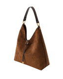 Brown faux suede shoulder bag with a dark brown strap, gold-toned hardware, and a decorative dark brown tassel.
