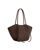Deep brown wide tote bag with two thin top handles, a vertical front seam, gold-toned "JW PEI" logo, and two long side ties.