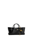 Black faux leather tote bag with top handles, white stitching, a gold-toned buckle, and a gold-toned dachshund charm.