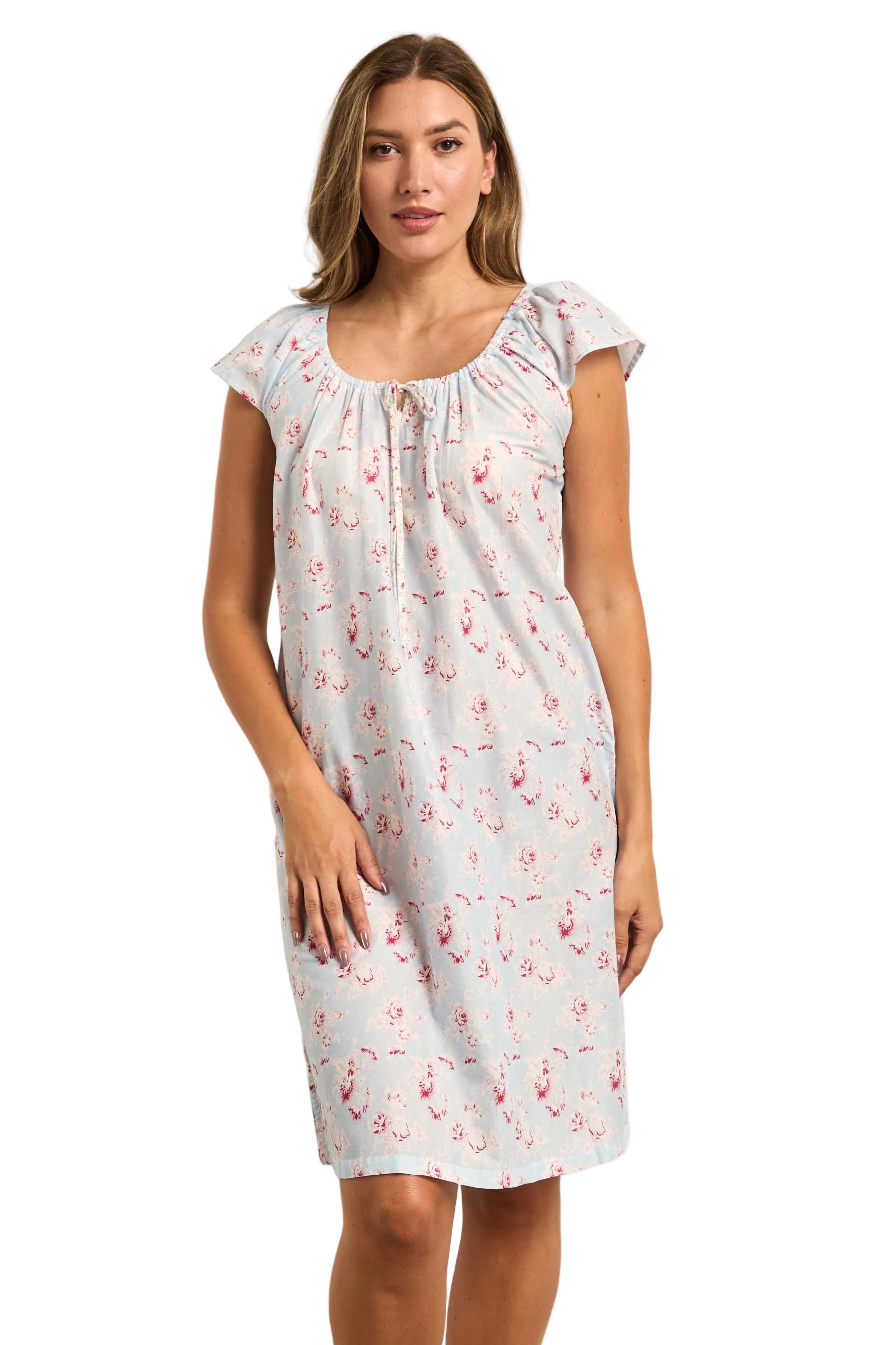 Light blue supervoile dress with pink floral pattern, cap sleeves, and a gathered scoop neckline with a tie detail.