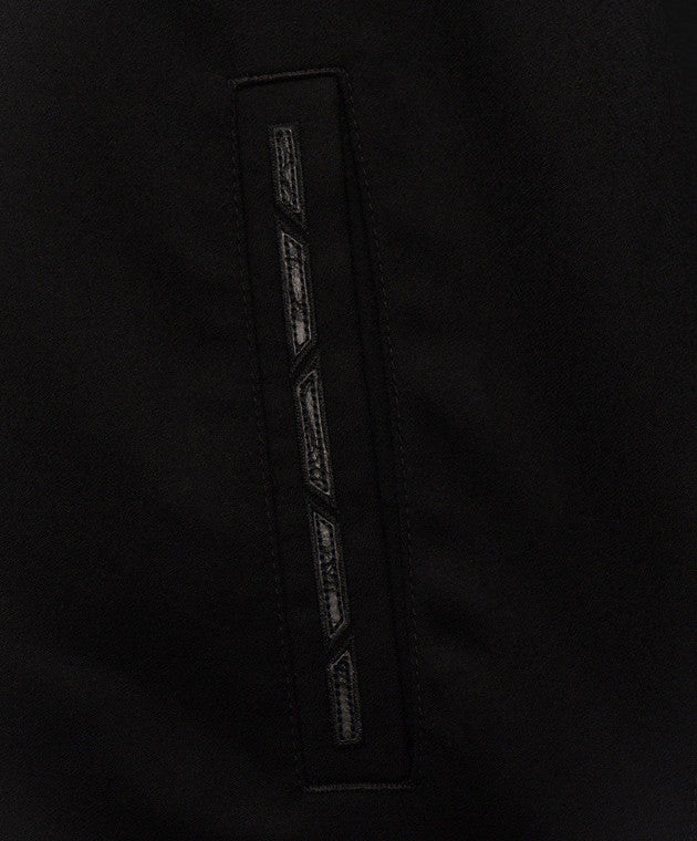 Black fabric with a vertical black panel featuring four segmented, textured dark gray geometric patterns.