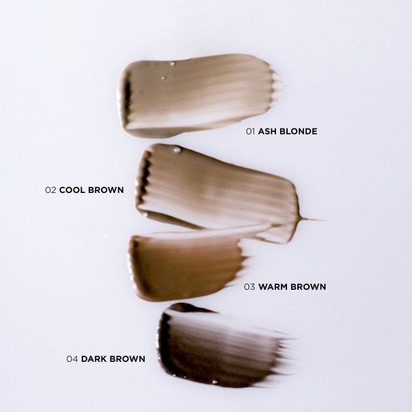 A dark brown, creamy brow product swatch with a slightly glossy finish, spread in a brush-stroke pattern.