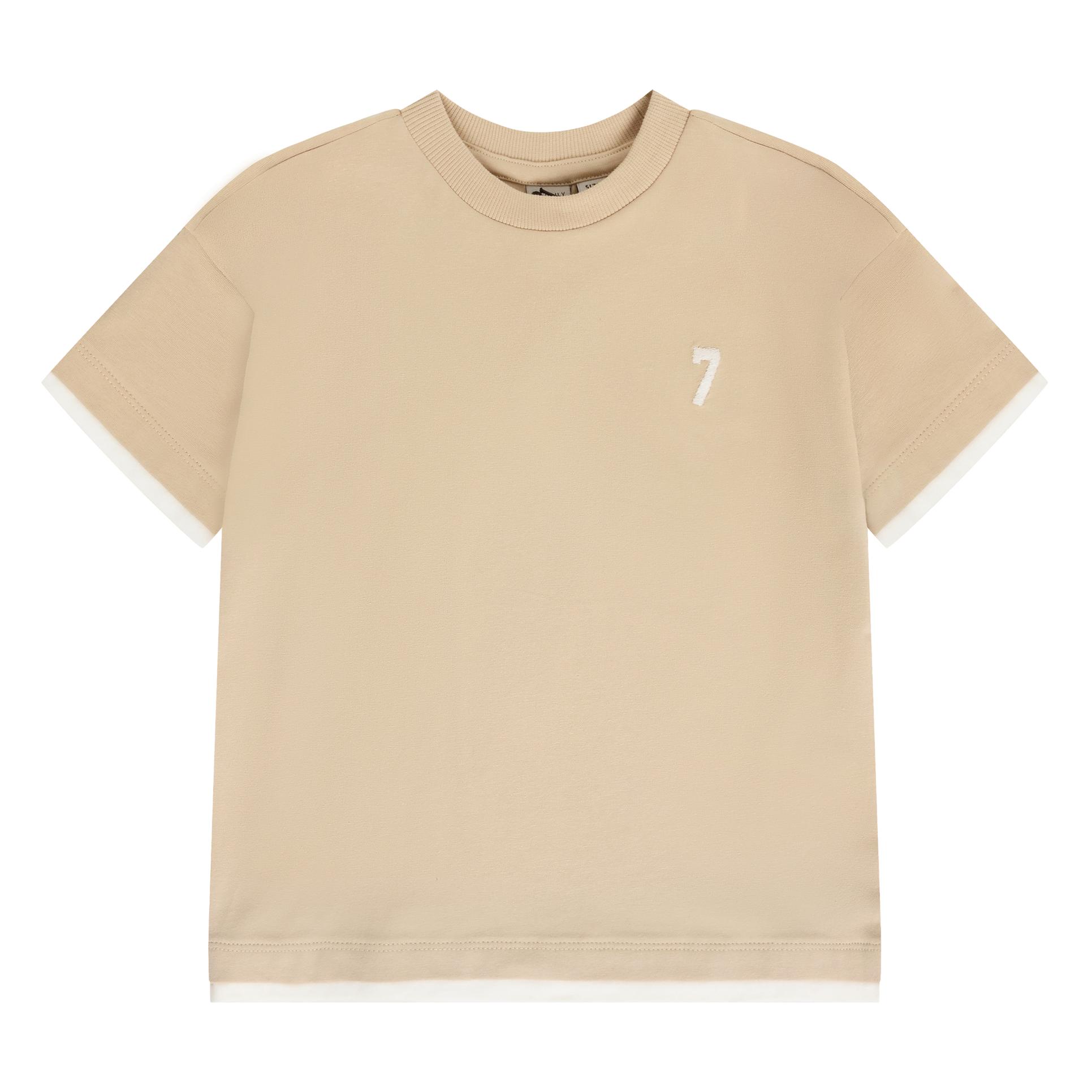 Beige oversized kids' t-shirt with a ribbed crew neck, short sleeves, white layered cuffs and hem, and an embroidered white n