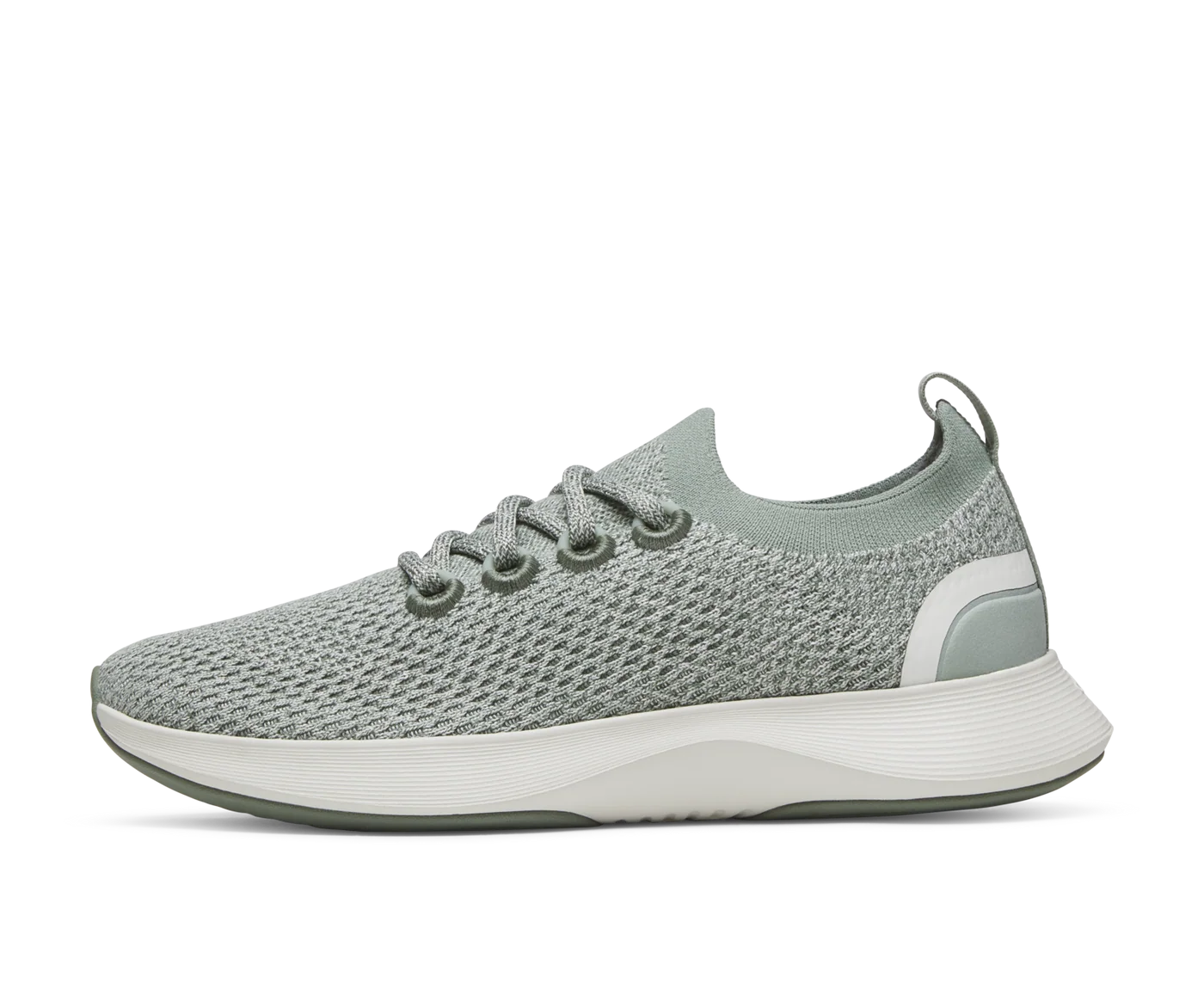 Light green knit athletic sneaker with off-white midsole, darker green outsole, and white stripe detail on the heel.