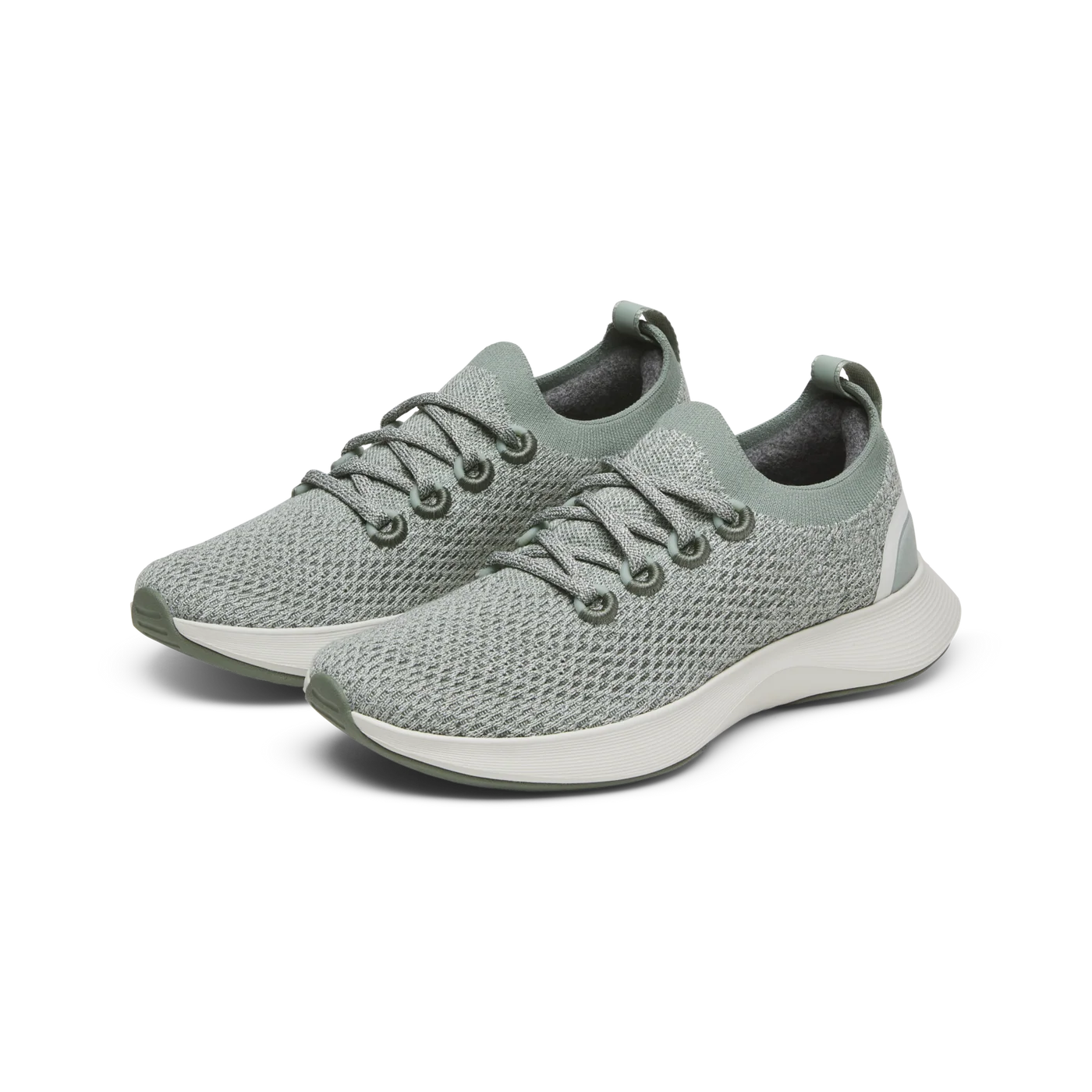 Pair of textured sage green knit sneakers with matching laces, sock-like ankle, and a white sole with green trim.
