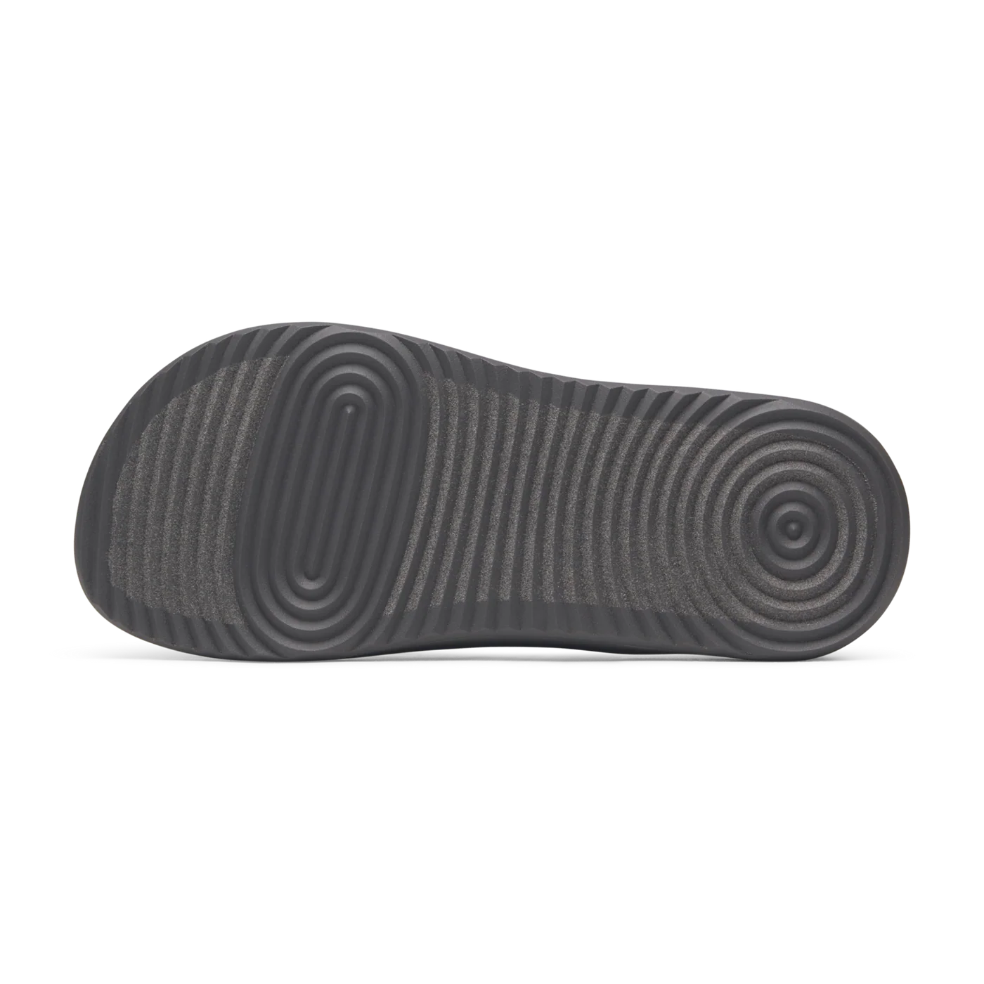 Dark grey flip flop sole with granular toe texture, wavy mid-foot ridges, and concentric heel circles.