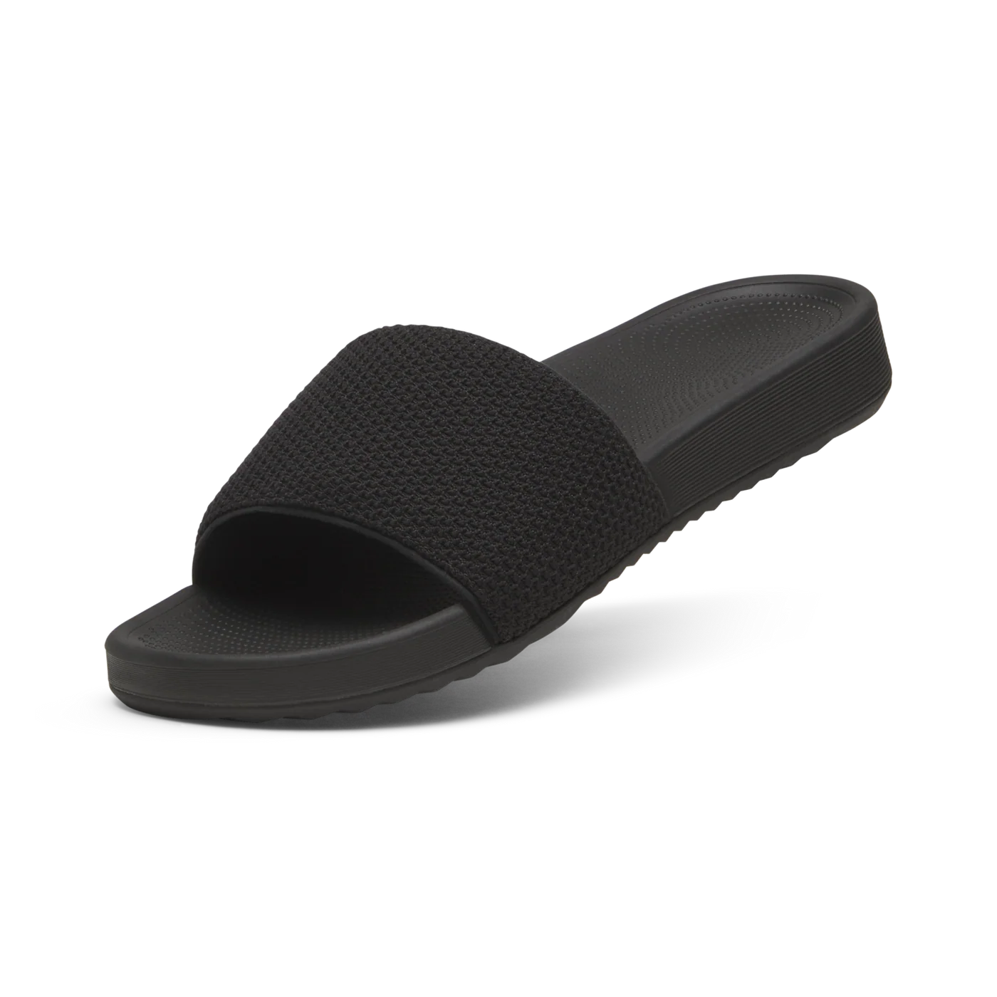 Black slide sandal with a wide, textured knit upper strap and a solid black contoured sole.