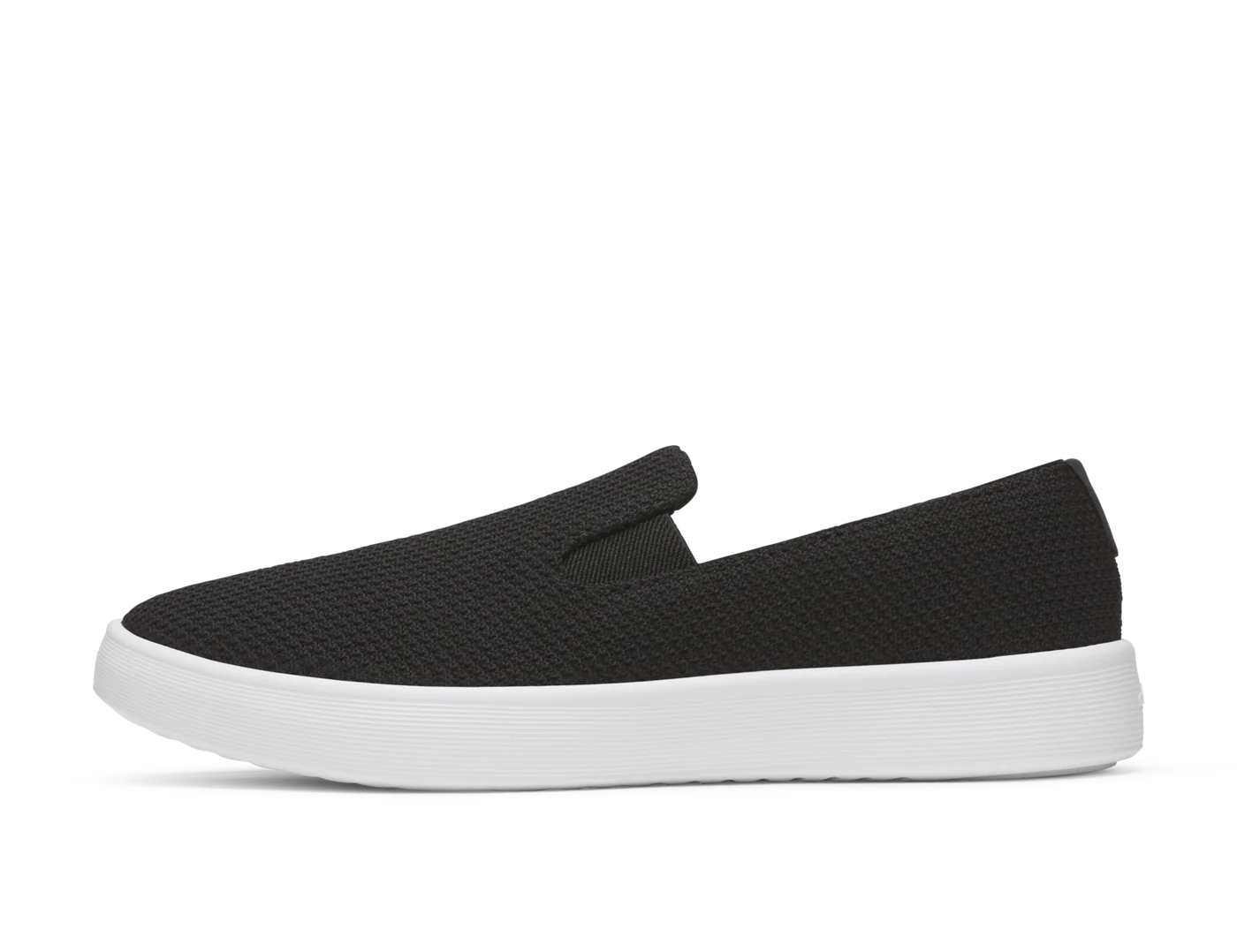 Black knit fabric slip-on shoe with a rounded toe and a thick white platform sole, viewed from the side.