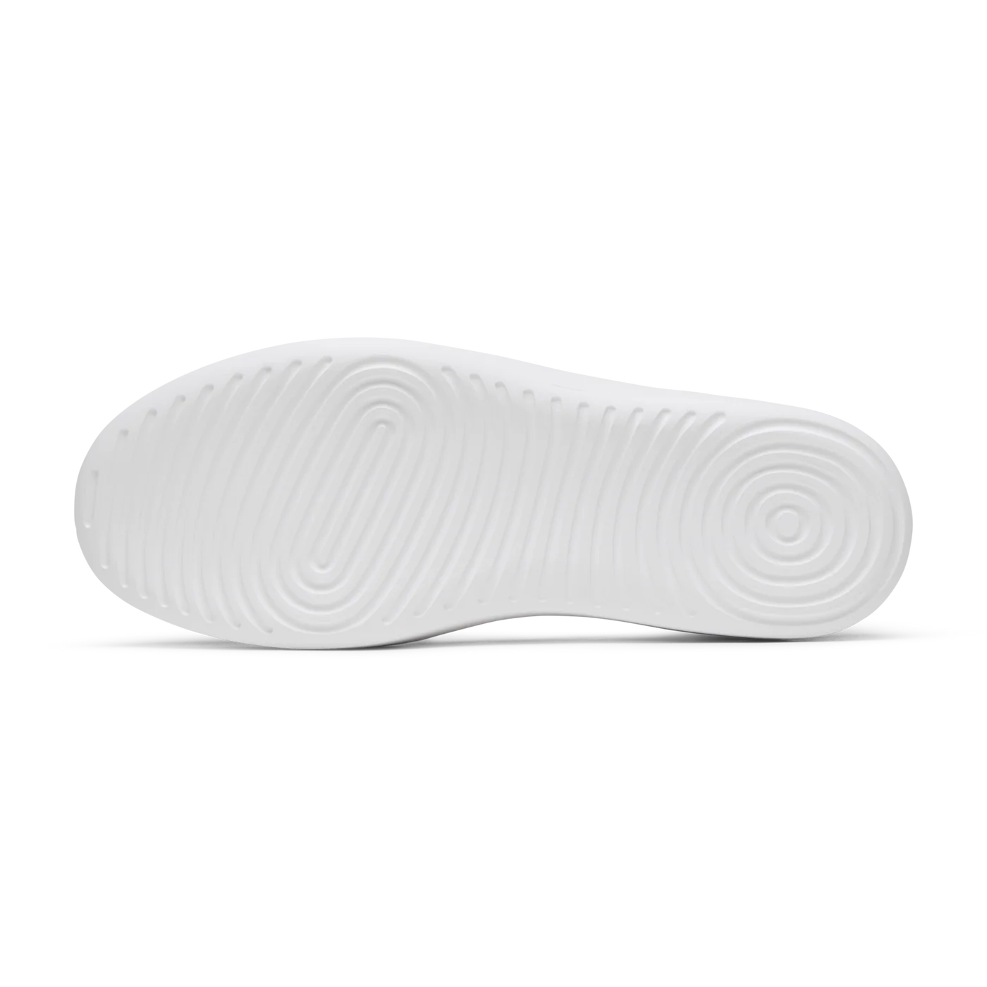 White shoe sole with a textured pattern of concentric ovals and circles.