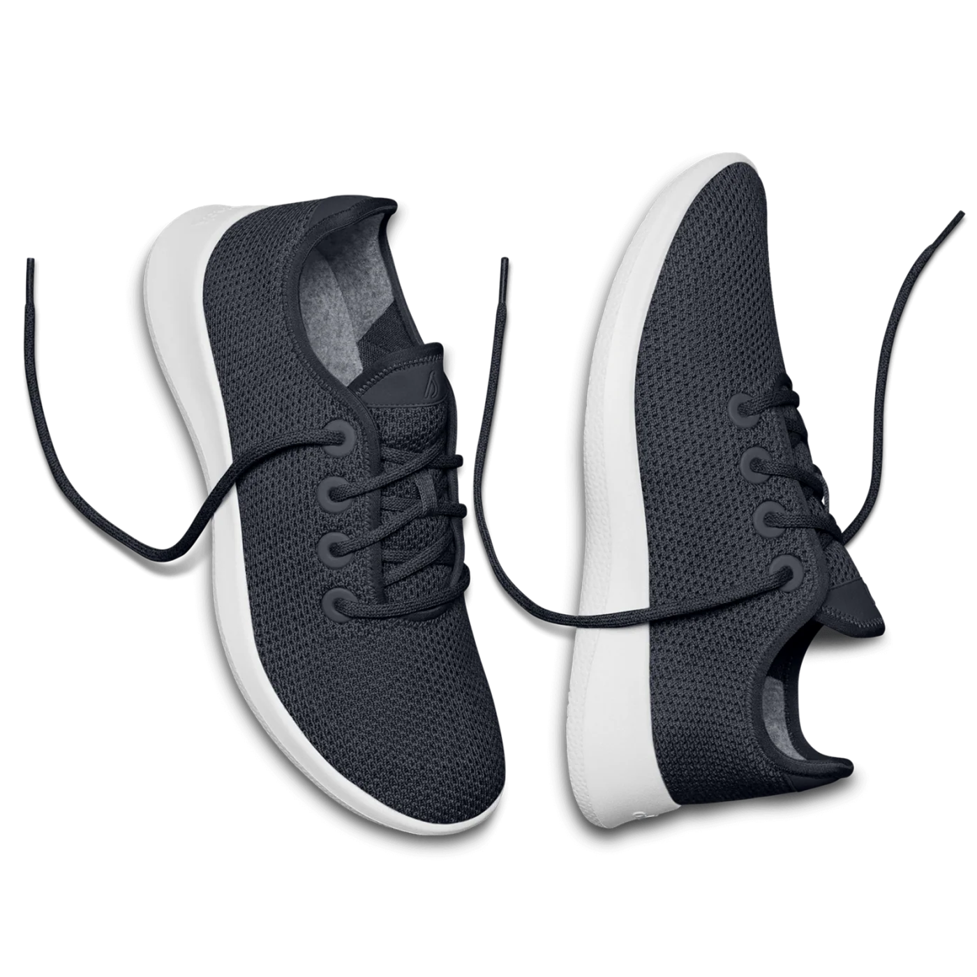 Pair of dark blue mesh sneakers with white soles and matching dark blue laces. The laces are untied.