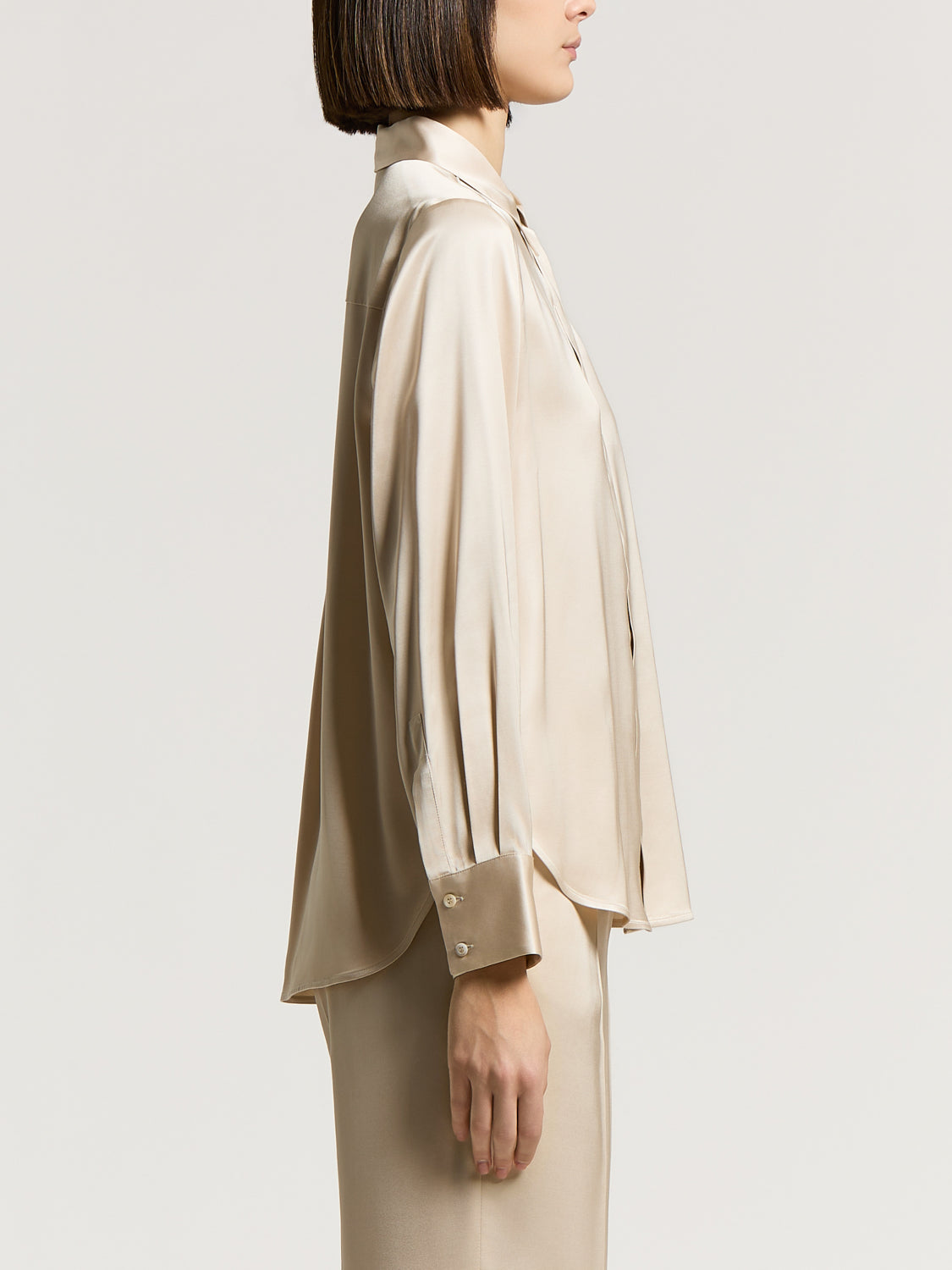 Star Dust Beige viscose satin shirt with a collar, long sleeves, and wide buttoned cuffs featuring light-colored buttons.