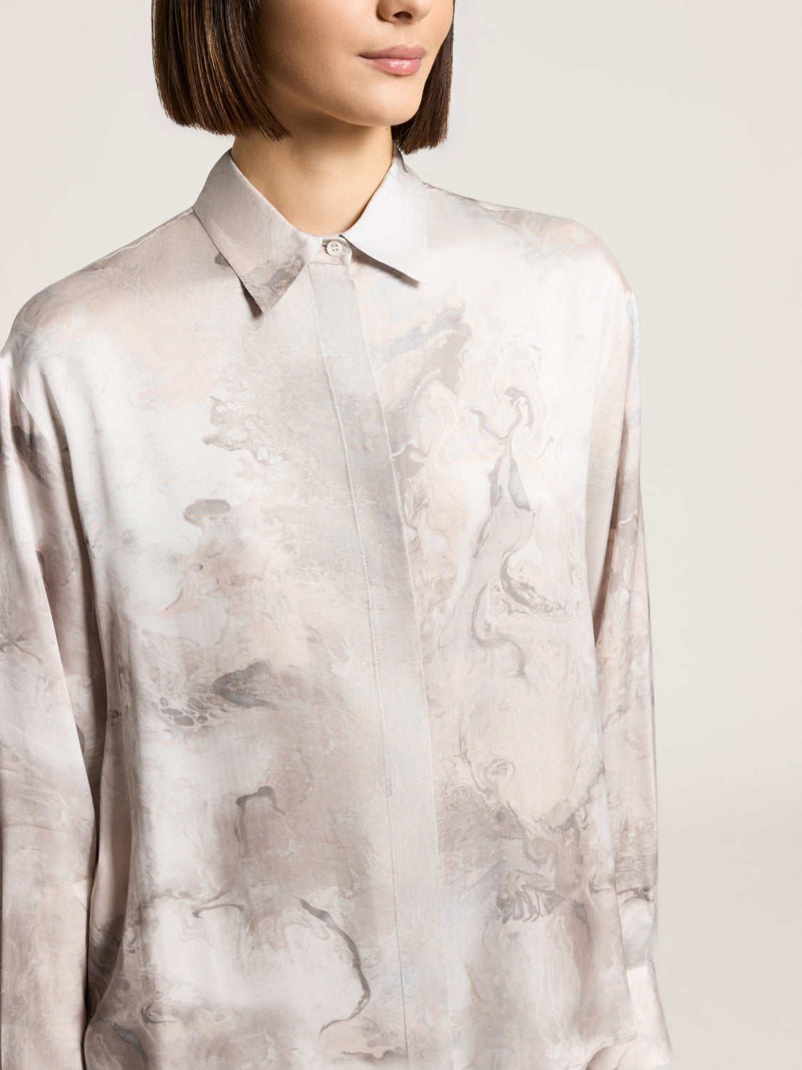Fluid viscose shirt with a muted pink and grey marbled pattern, featuring a classic collar and button placket.