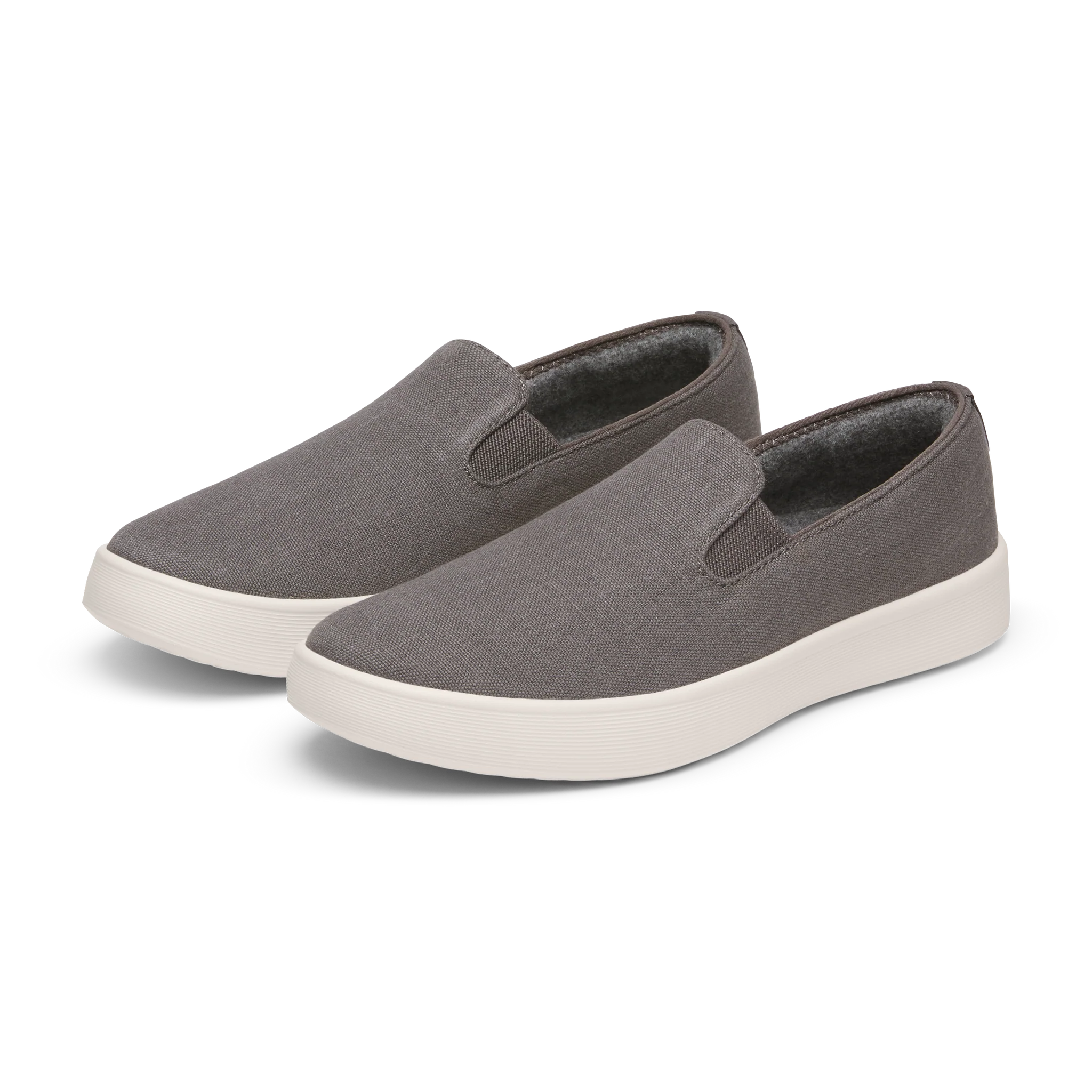 Pair of grey textile slip-on shoes with white platform soles, elastic side goring, and a dark brown collar.