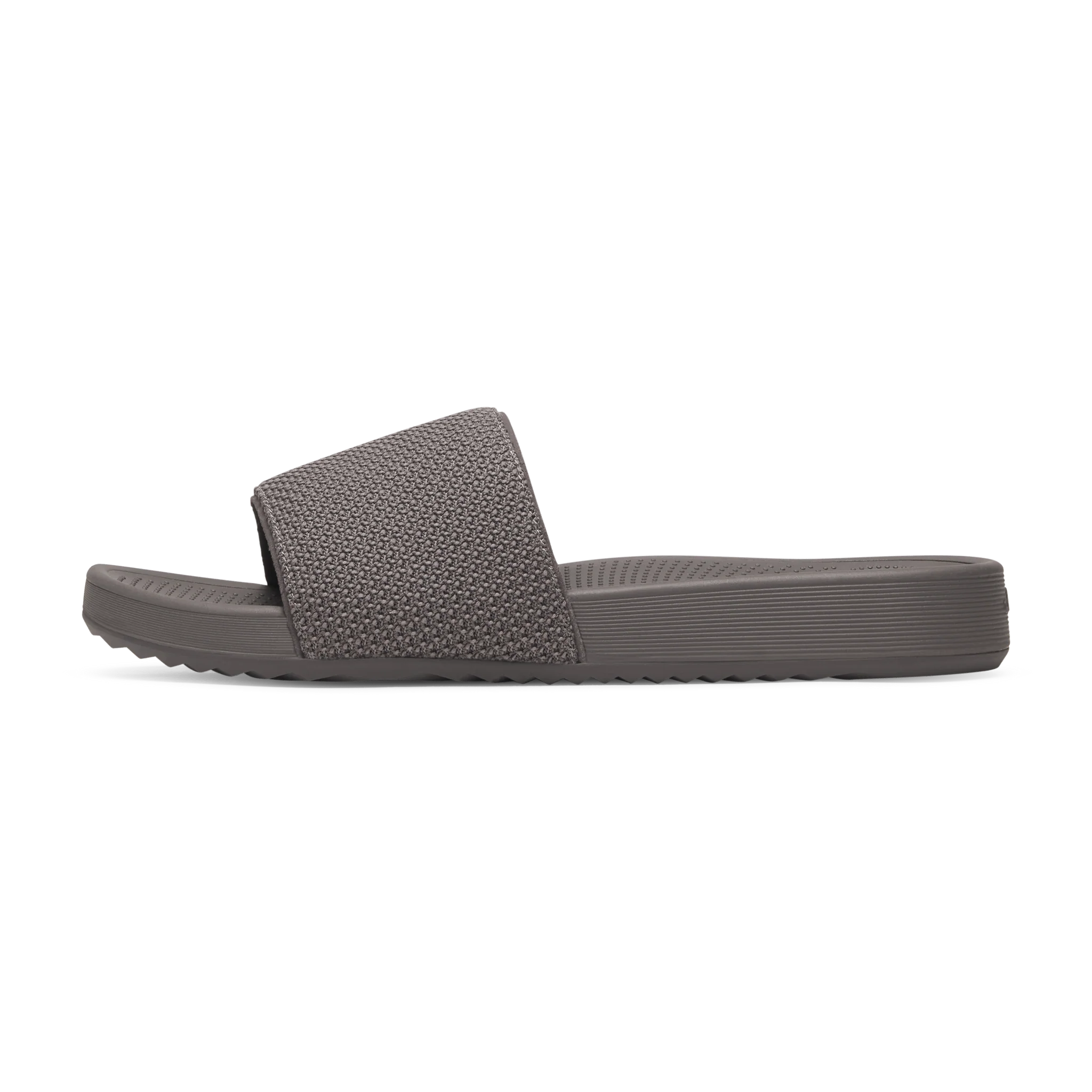 Single grey slide sandal with a textured knit strap and a ribbed, contoured footbed.