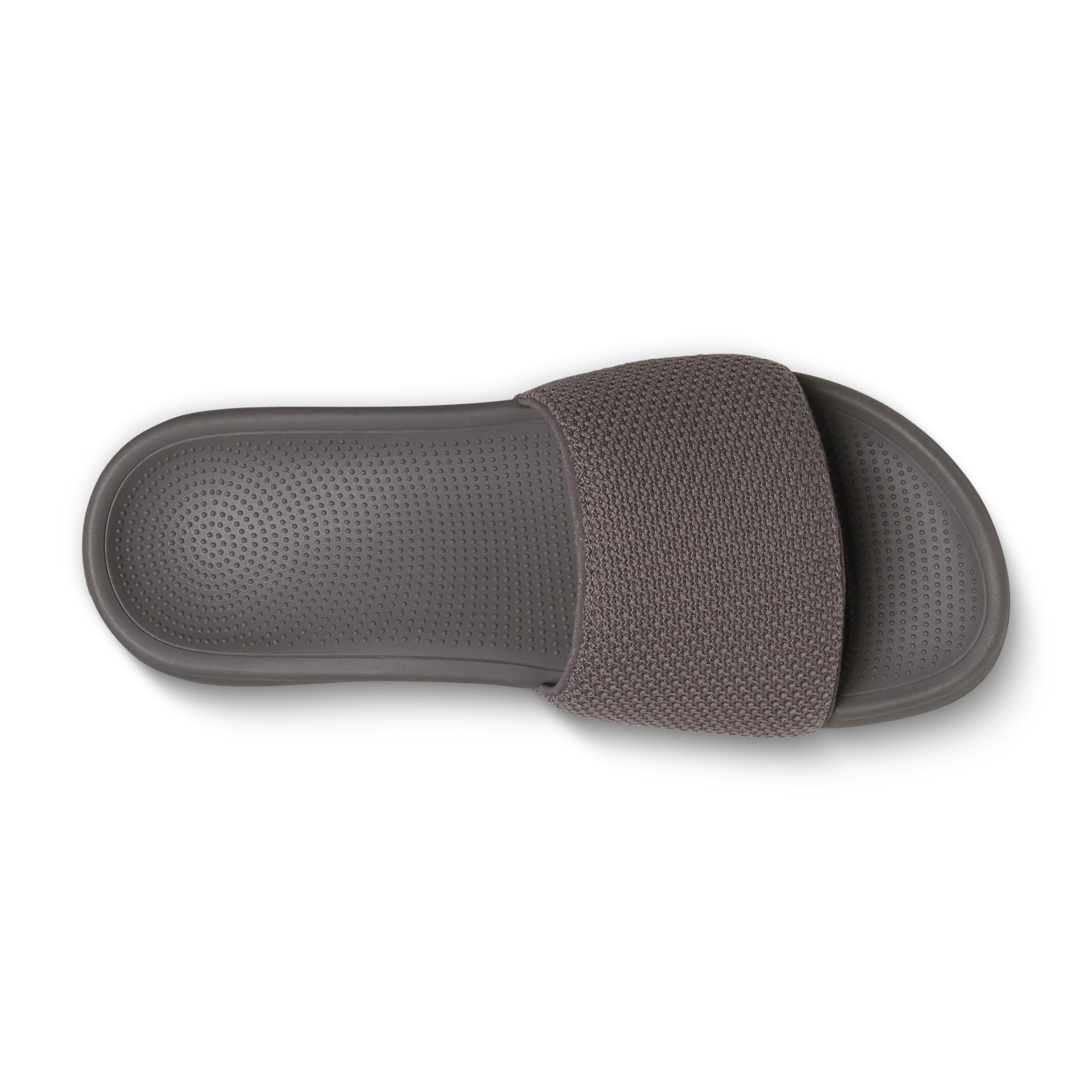 Grey slide sandal with a wide, knitted textile strap and a textured, dotted footbed.