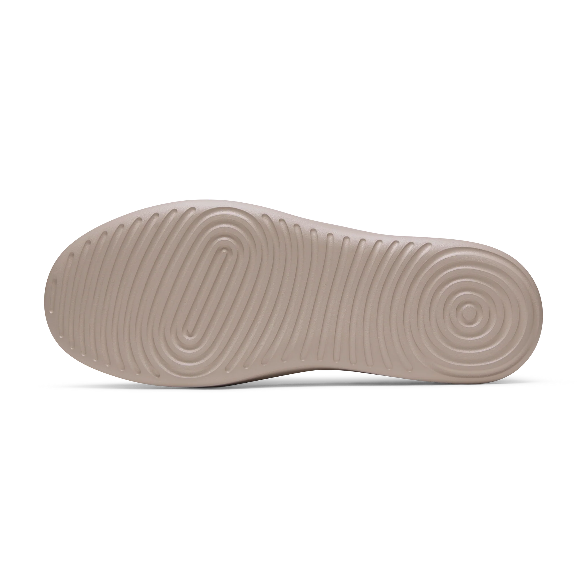 Light brown shoe sole with an oval concentric pattern at the toe, curved parallel ridges in the middle, and a circular patter