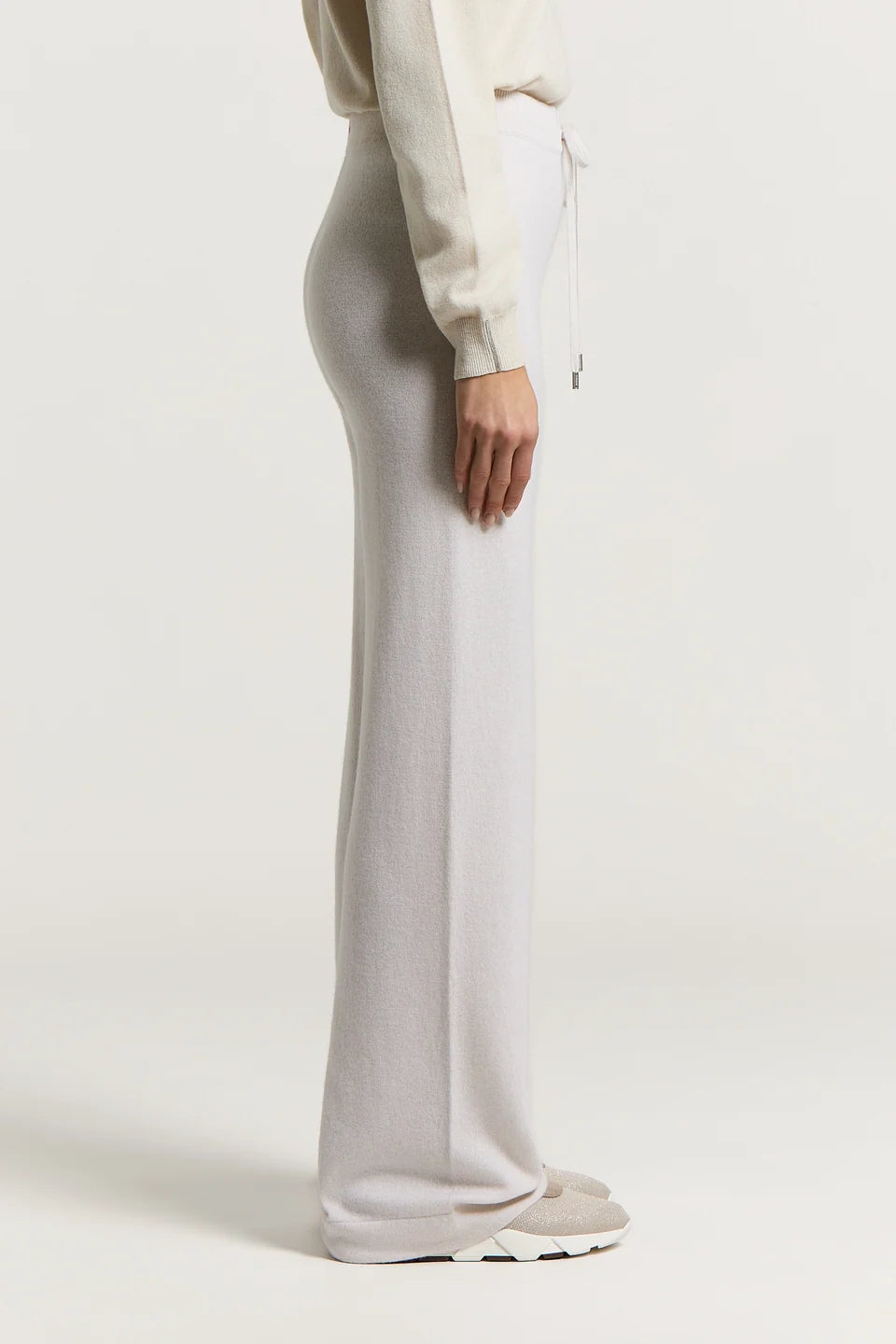 Star dust beige wide-leg pants with a soft texture, drawstring waist with silver-toned tips, and front creases.