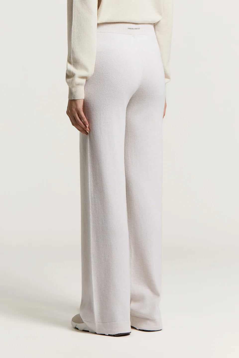 Star dust beige wide-leg pants with a soft, fuzzy texture and a ribbed elastic waistband with a small silver-toned tag.