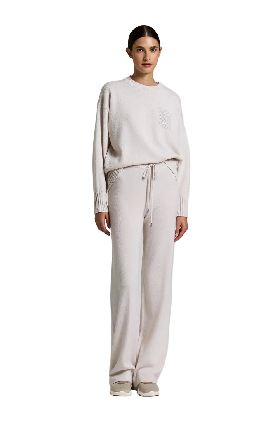 Stardust beige knit sweater with a textured square on the chest, and matching wide-leg pants with a drawstring waist and silv