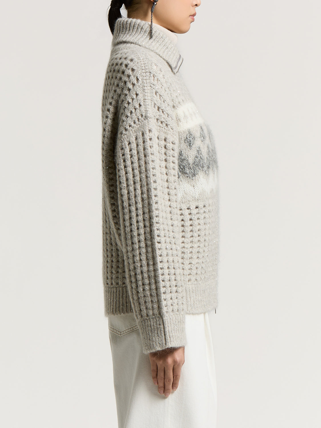 Lunar gray turtleneck sweater with an open-knit body, ribbed sleeves, and a white and dark gray Fair Isle pattern on the ches