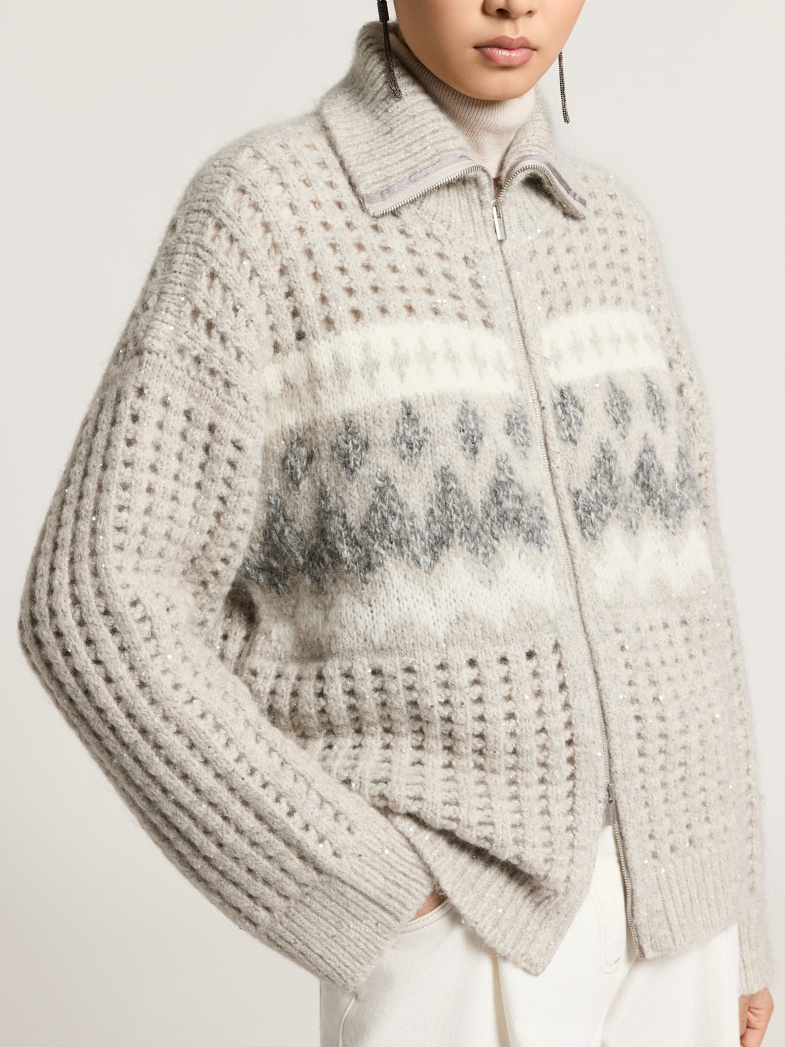 Lunar gray full-zip sweater with a collar, featuring white and dark gray Fair Isle pattern, open-knit sections, and subtle se