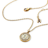 Gold-toned Aigner Brunella short necklace with a circular pendant featuring the Aigner 'A' logo and clear crystal embellishme