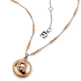 Rose gold-toned and silver-toned stainless steel short necklace with a circular rose gold-toned pendant featuring a crystal-e