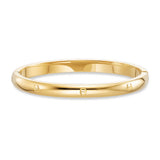 Large gold-toned stainless steel bangle with embossed Aigner horseshoe logos.