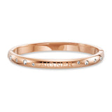 Rose gold-toned stainless steel bangle with clear faceted stones and debossed Aigner logo, featuring a hinge closure.