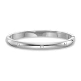 Silver-toned stainless steel bangle with a polished finish and multiple embossed Aigner horseshoe logos around its circumfere