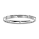 Silver-toned stainless steel bangle with a polished finish, featuring multiple embossed Aigner horseshoe logos around its cir