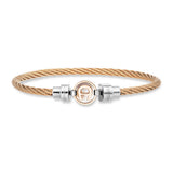 Rose gold-toned braided stainless steel bangle with a central circular Aigner logo emblem and silver-toned engraved end beads