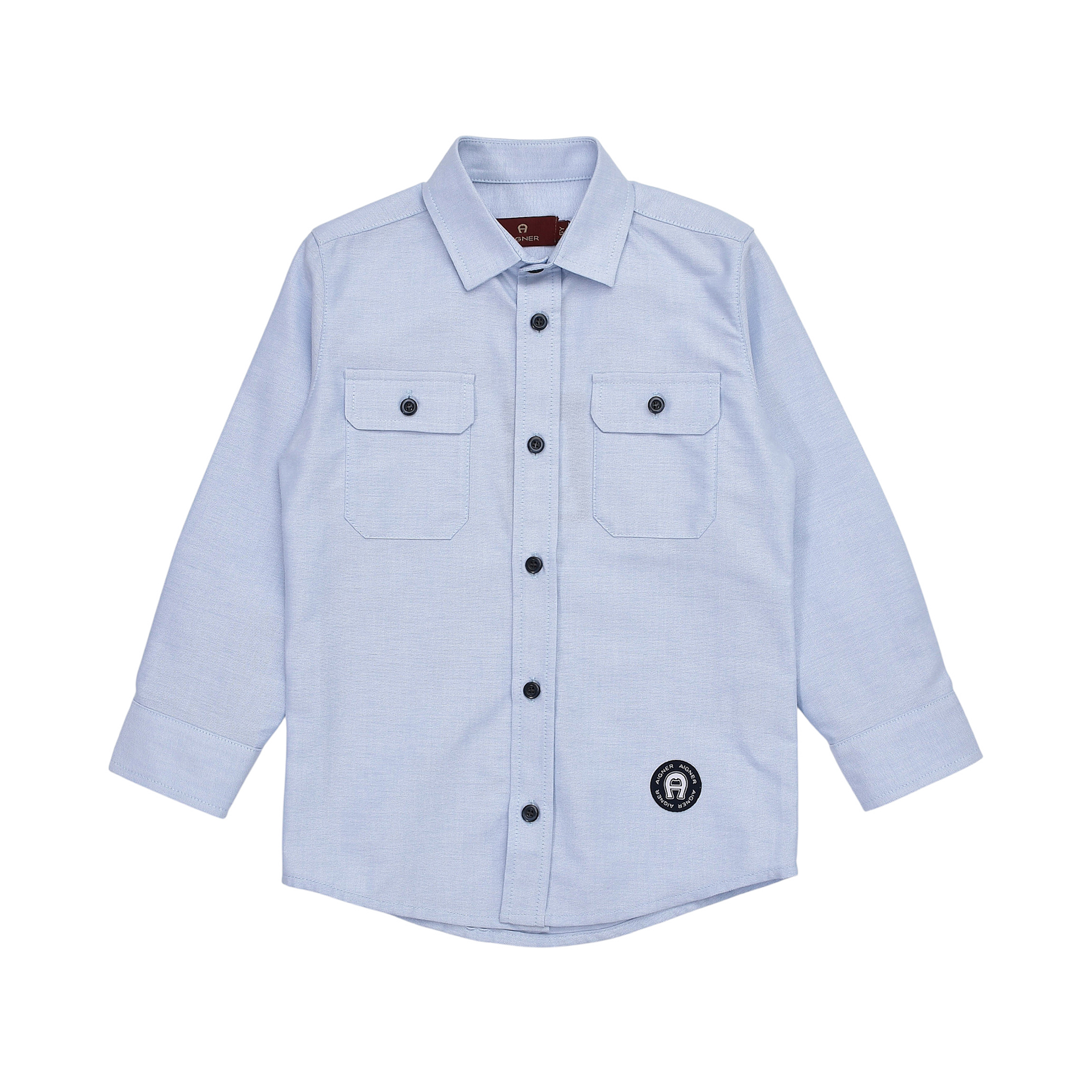 Light blue long-sleeved collared shirt with black buttons, two chest pockets, and a circular brand logo patch.