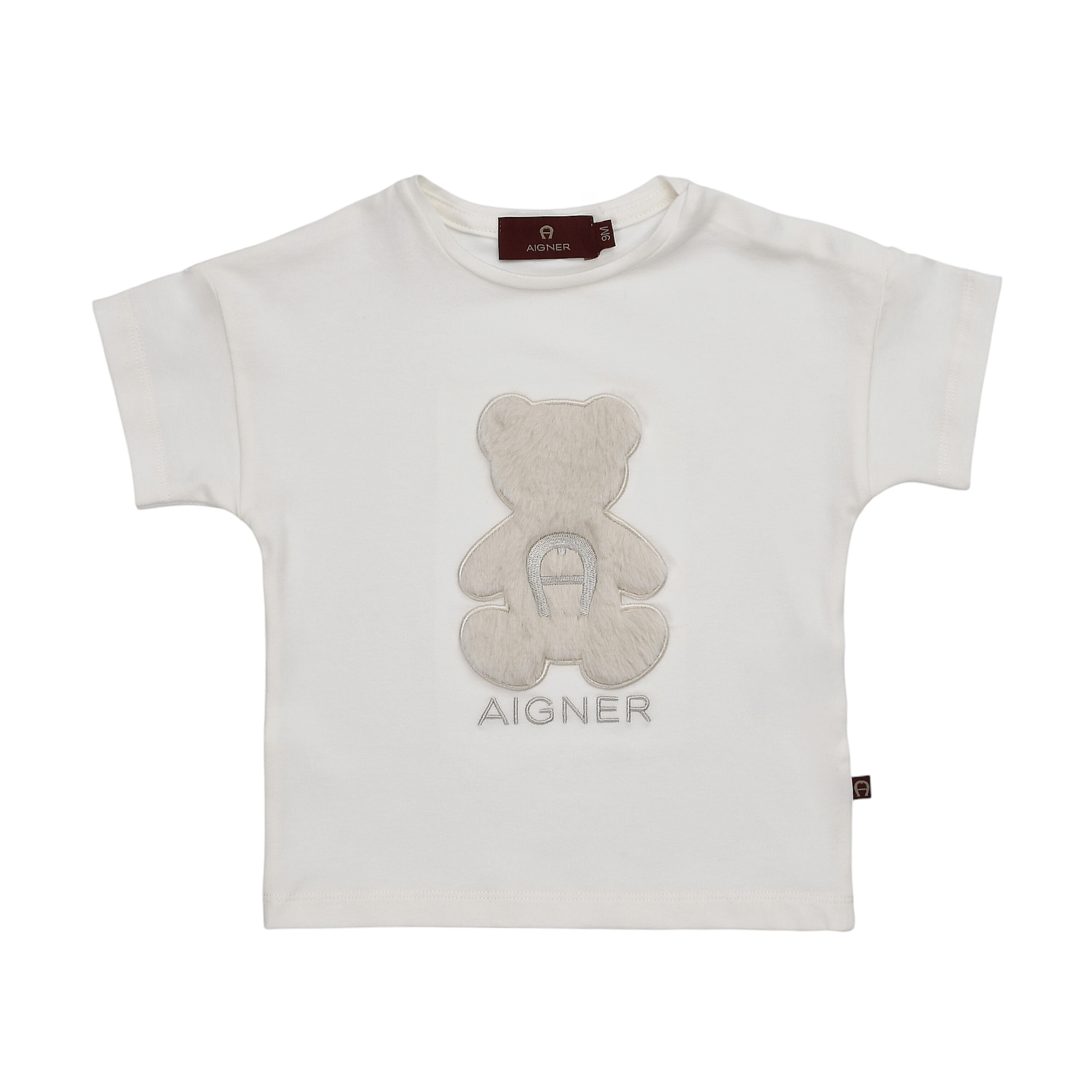 Beige short-sleeved t-shirt with a lighter beige fluffy teddy bear appliqué featuring an embroidered Aigner 'A' logo.