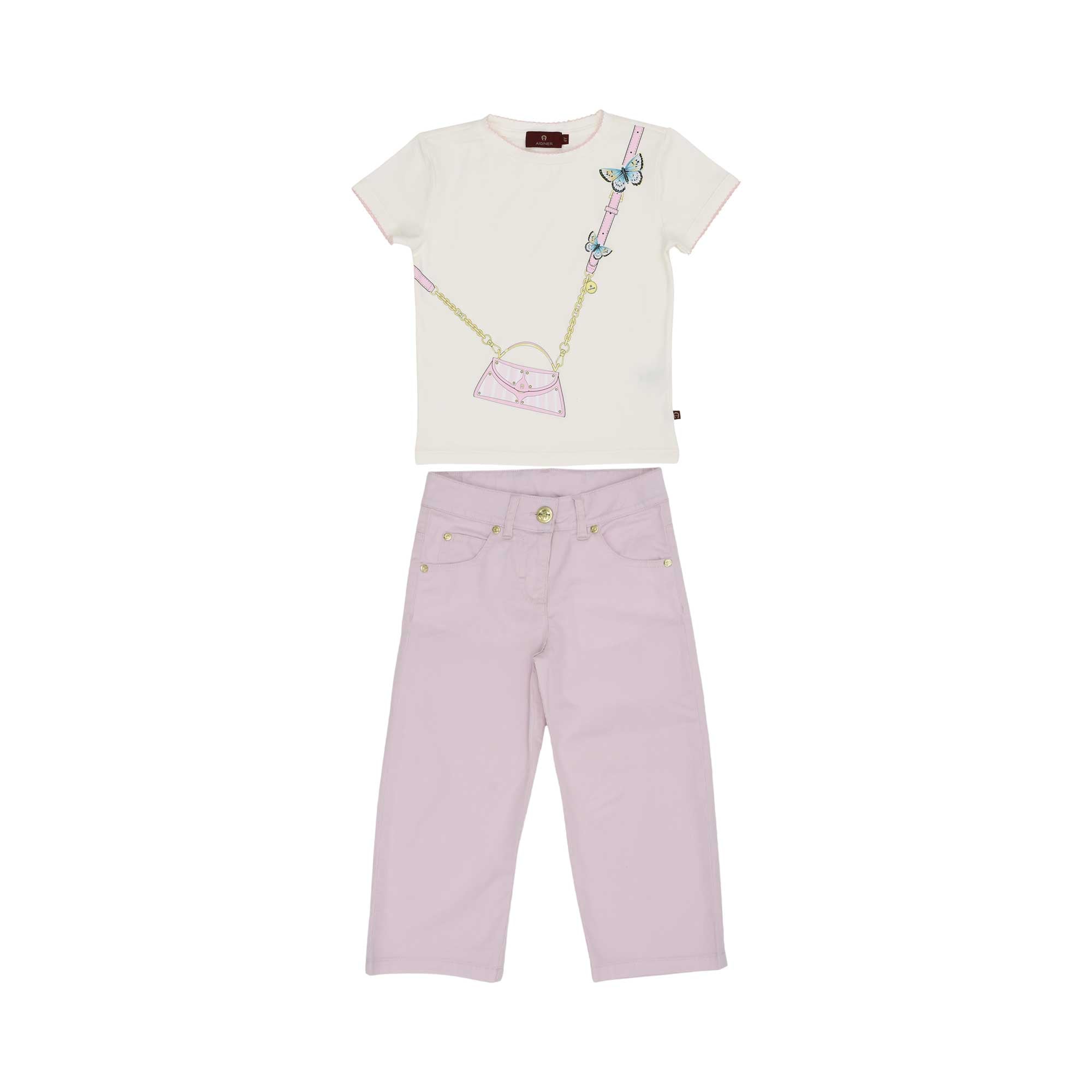 A girls' outfit featuring a cream t-shirt with a pink handbag and blue butterfly graphic, paired with lilac straight-leg trousers with gold buttons.