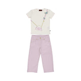 A girls' outfit featuring a cream t-shirt with a pink handbag and blue butterfly graphic, paired with lilac straight-leg trousers with gold buttons.